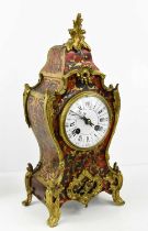 A 19th century French boulework mantle clock, the mechanism stamped Made in Paris, and numbered