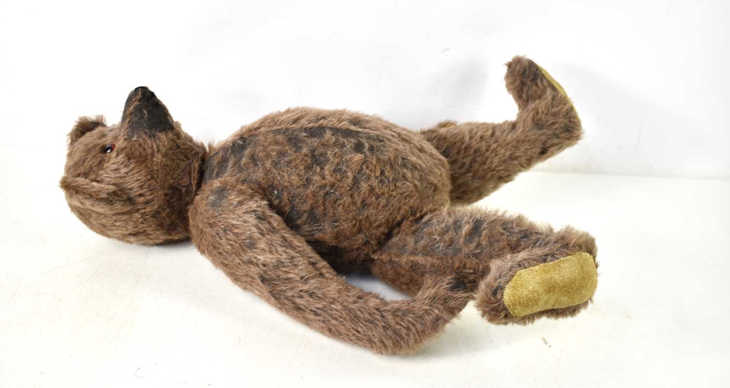 A straw filled teddy bear, in the style of Steiff, brown mohair body, swivel head and jointed at - Image 2 of 6