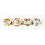Four Royal Crown Derby bone china Butterflies of the World trinket dishes with covers.