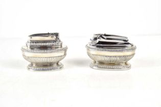 A pair of vintage silver plated table lighters in the Queen Anne pattern.
