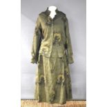 A vintage Holland & Holland blouse and skirt in olive green with repeating pattern of a labrador