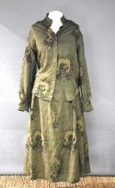 A vintage Holland & Holland blouse and skirt in olive green with repeating pattern of a labrador