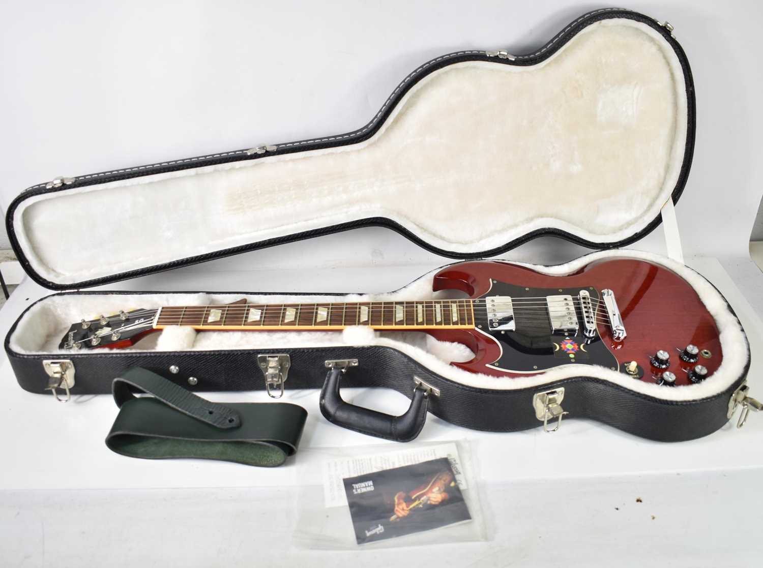 A Gibson SG Standard left handed electric guitar, made in USA, with original case and paperwork,