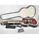 A Gibson SG Standard left handed electric guitar, made in USA, with original case and paperwork,
