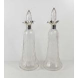 A pair of Art Deco hand cut and wave blown wine decanters with silver William Hutton and Sons