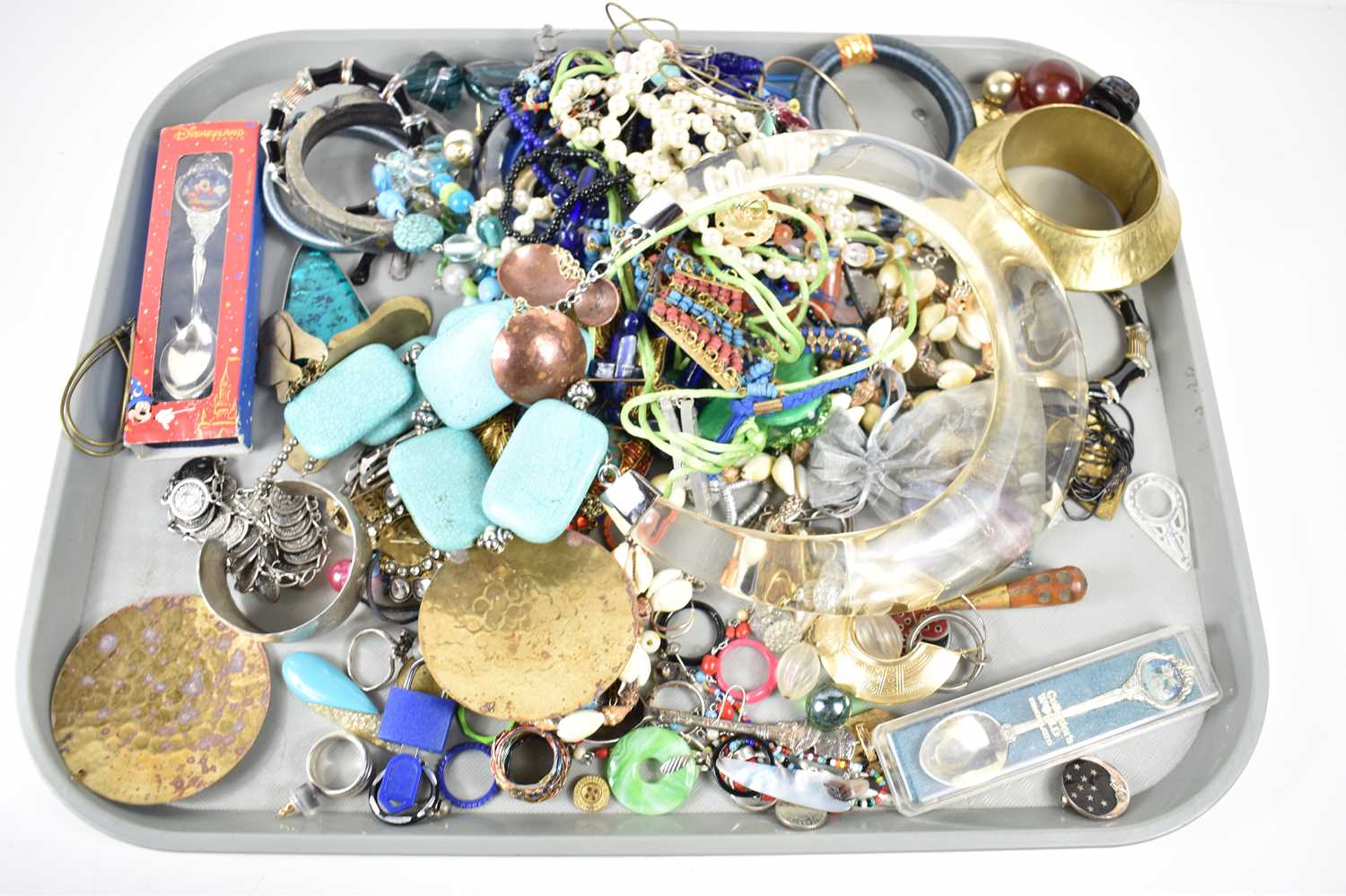 A collection of costume jewellery to include pewter bracelet, necklaces, earrings and other items.