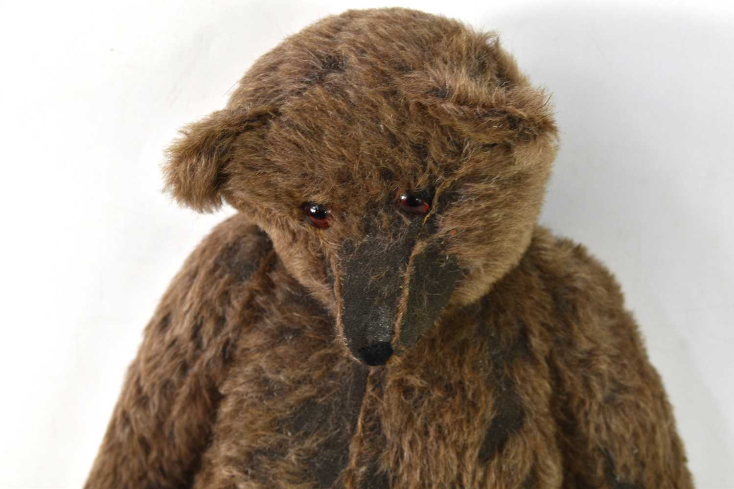 A straw filled teddy bear, in the style of Steiff, brown mohair body, swivel head and jointed at - Image 3 of 6