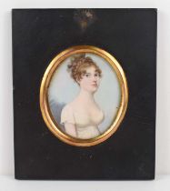 British School: A 19th century portrait miniature of a young woman in a white dress, watercolour