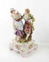 A 19th century German porcelain figure group, gentleman with walking cane and lady with pail,