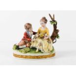 A 20th century Capodimonte figure group of two children in 18th century costume, with oval base,