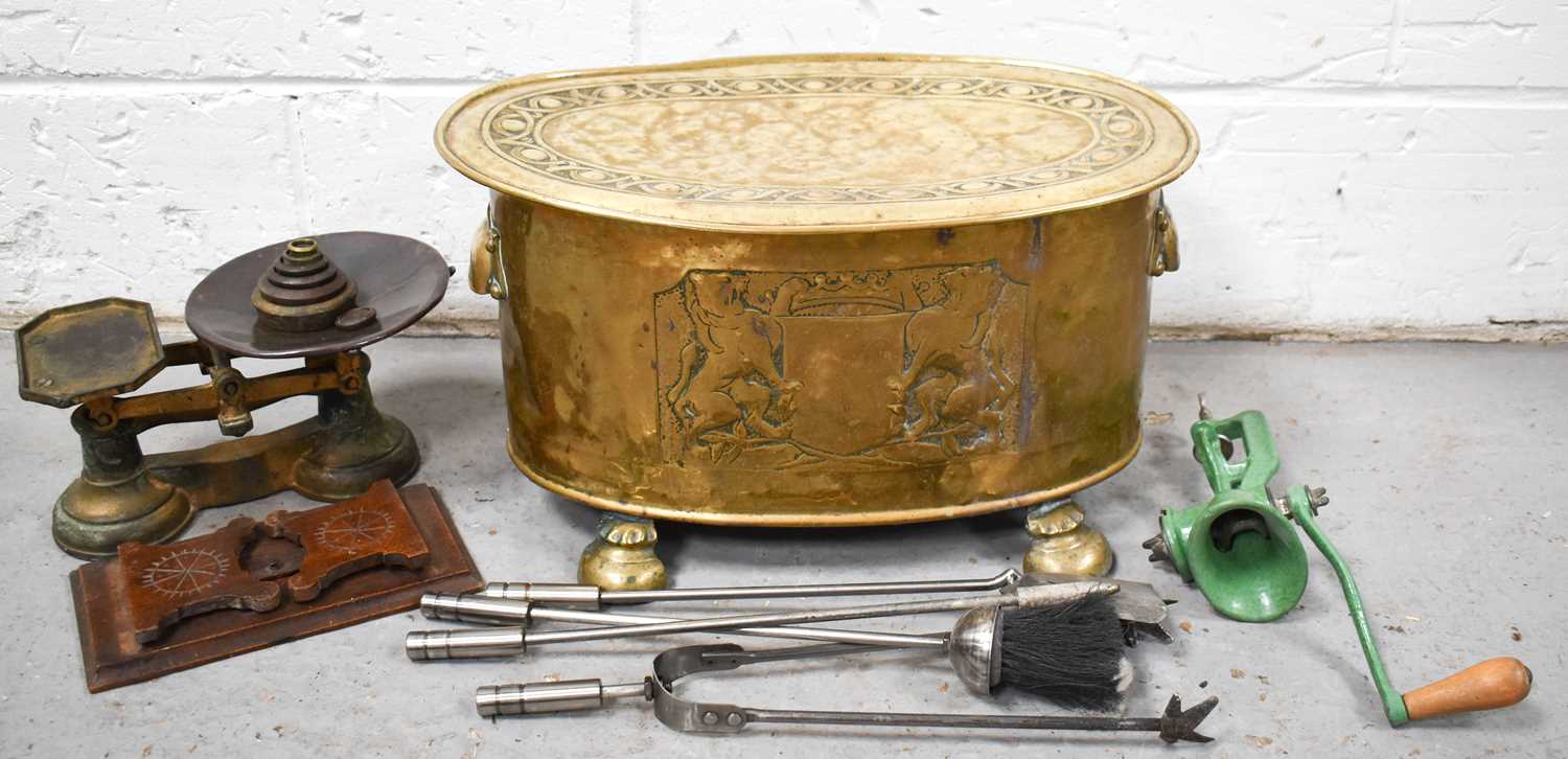 A group of domestic items, comprising an Arts and Crafts brass coal or log box of oval form, with