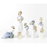 A group of Rex and Nao porcelain figures, comprising Nao nurse and baby and girl with a bird,