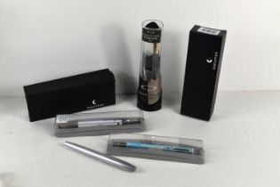 A group of four Parker pens together with a Shaeffer example.