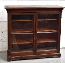 An Edwardian stained pine glazed cabinet with three height adjustable shelves, 106cm by 117cm by