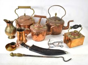 A group of copper and brassware to include kettles, tankard and jug together with a Kukri knife