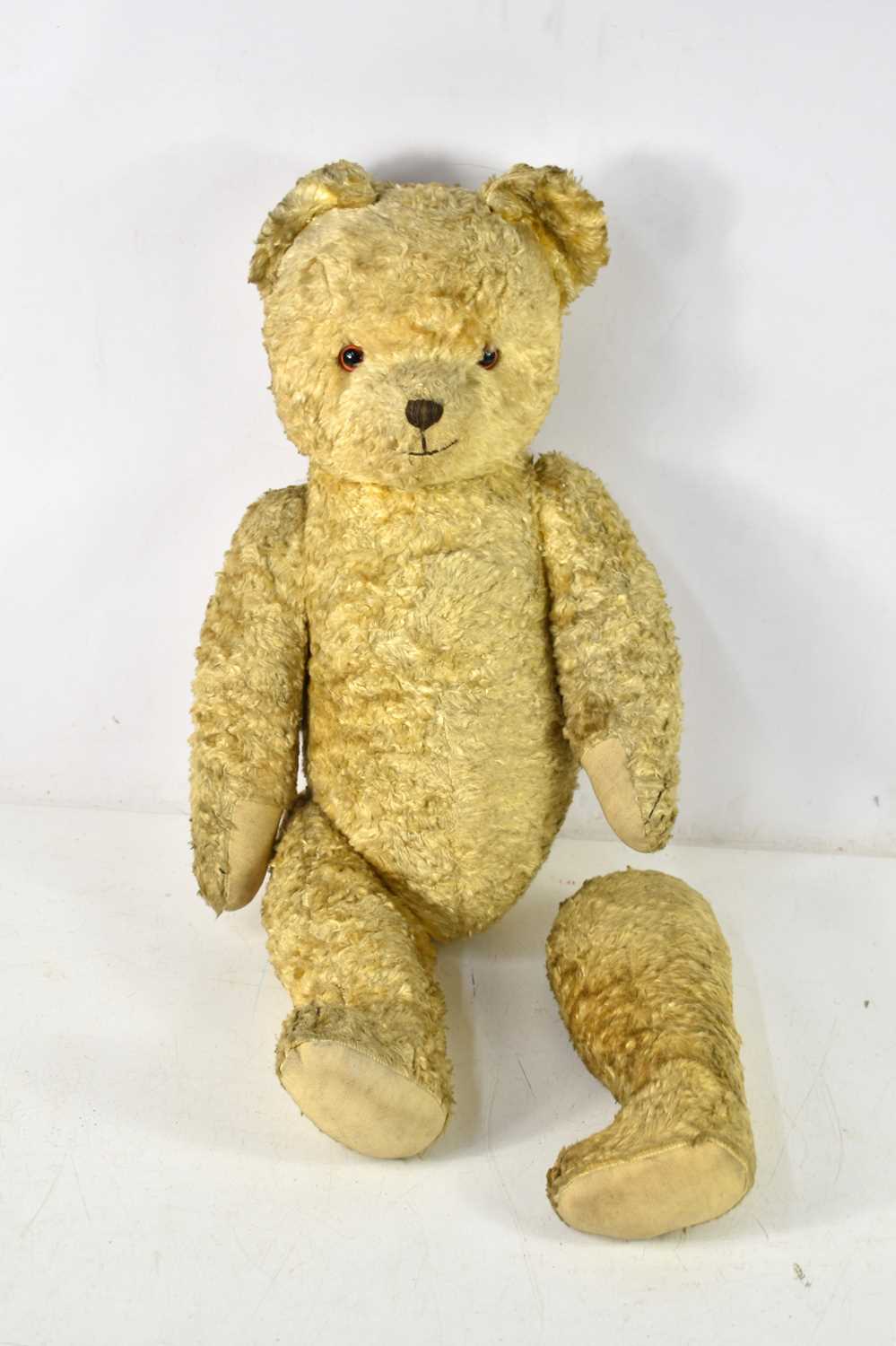 A vintage excelsior filled teddy bear, the bear having four paws and measuring 62cm, a/f,