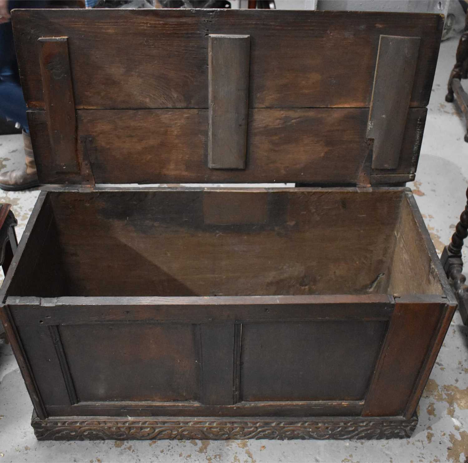 A 17th century oak coffer, with plank top and two panel front, 49 by 94 by 43cm. - Bild 2 aus 2