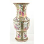A 19th century Chinese Famille Rose vase, decorated with figural scenes, insects and flowers,