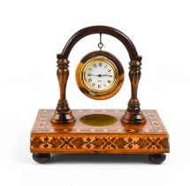 A 19th century Victorian arch form watch stand, the base having a border of geometric repeating