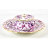 A Meissen lidded pot and saucer, decorated in a detailed purple floral pattern with gilding to the