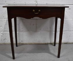 A Georgian mahogany side table with single drawer above shaped apron and square tapered legs, 72cm