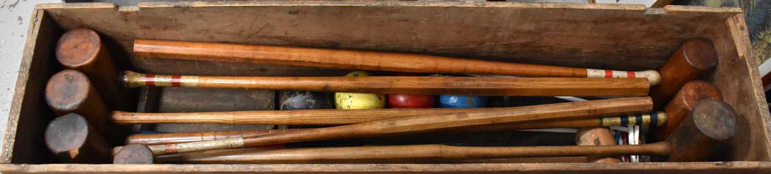 A vintage croquet set, in the original box.