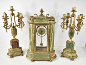 A German clock garniture in the neo-classical style, the clock with Hettich movement, green onyx and