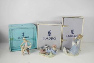 Three porcelain Lladro figurines; Study Buddies, Ballet Dancer, Girl with Puppy, all with the