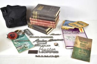 A group of engineering books and car related items to include a Caravan Club car badge, Austin