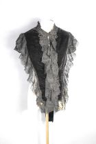 A Victorian velvet and lace mourning bodice with decorative jet bead work and tassels.