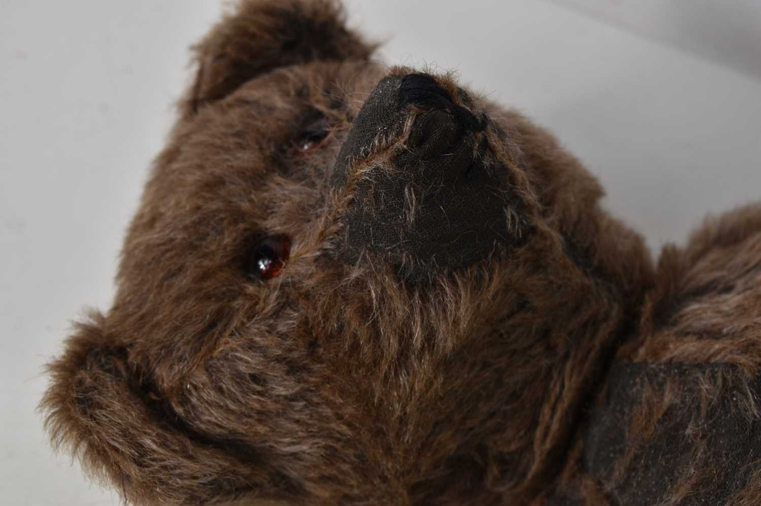 A straw filled teddy bear, in the style of Steiff, brown mohair body, swivel head and jointed at - Image 6 of 6