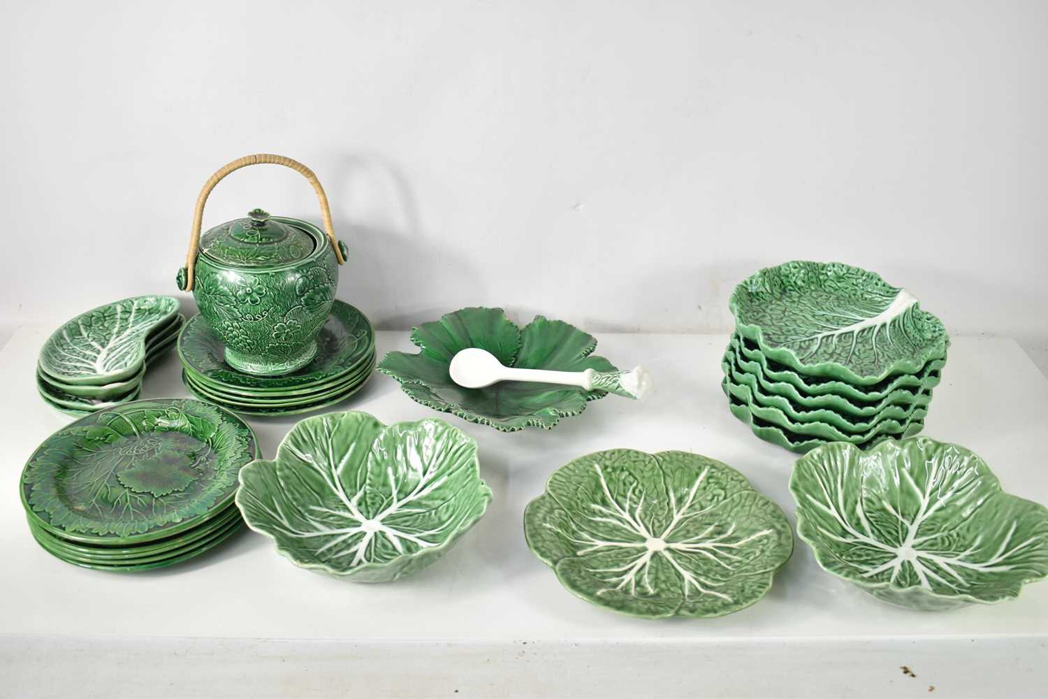 A group of various vine leaf and cabbage ware plates and dishes, including eleven vine leaf