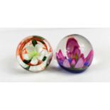 Two Caithness of Scotland glass paperweights: Festive Rose 288/150 and Melody, 525/650.