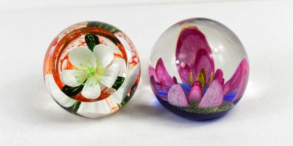 Two Caithness of Scotland glass paperweights: Festive Rose 288/150 and Melody, 525/650.