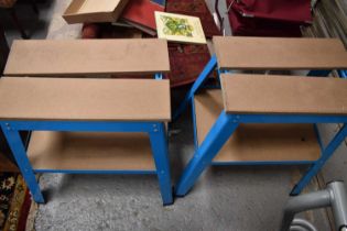 Two blue work benches / stands.
