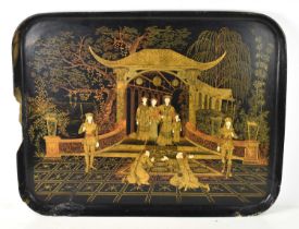 A 19th century Chinese black lacquered tray, gilded decoration throughout depicting courtly