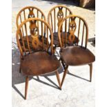 Four Ercol dining chairs with pierced back splats, H form stretchers.