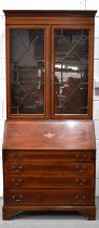 A Edwardian mahogany bureau bookcase with interior shelves, the drop down front housing fitted