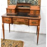 An Edwardian lady's writing desk, with twin galleried top, mirror backed and with hinged marquetry