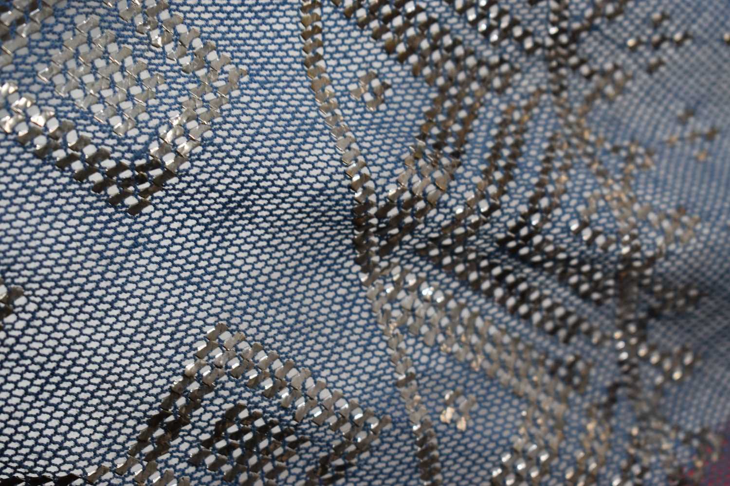 An Art Deco Egyptian Assuit shawl, the blue linen net with hammered silver abstract design, 78 by - Image 3 of 7