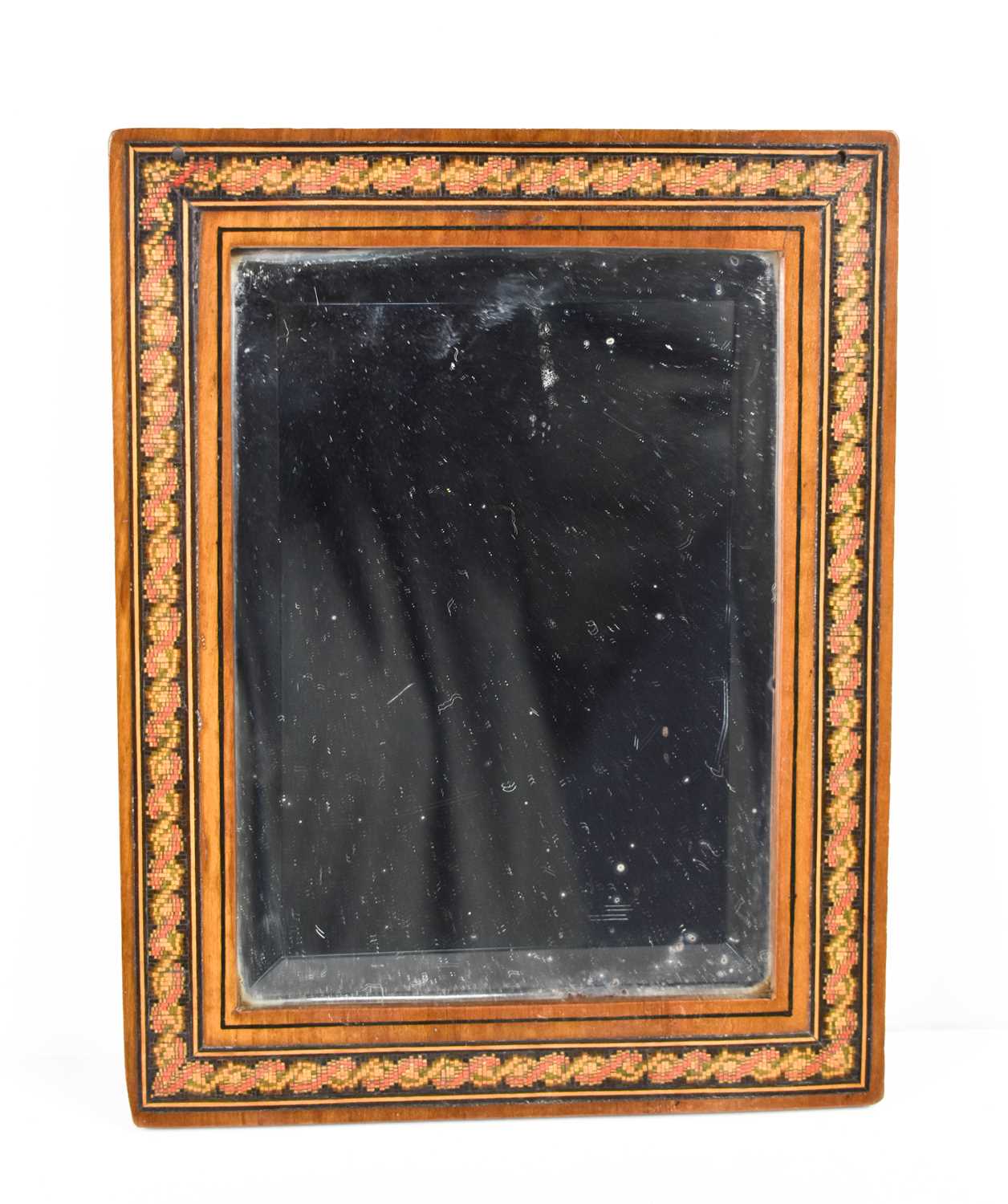 A small Georgian early 19th century mirror, the bevelled plate set within a repeating border, 20