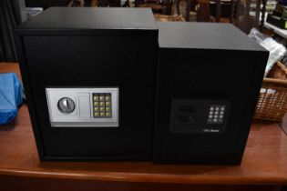 A Burg Wachter "Favor" electronic safe together with another unnamed example.