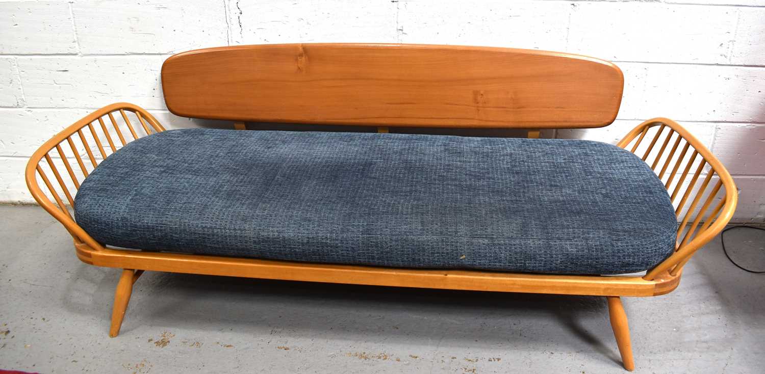 A Mid-Century Ercol elm and beech studio couch / daybed, model 355, designed by Lucian Ercolani.
