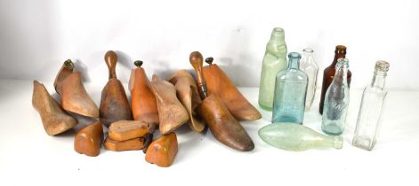A group of vintage wooden shoe lasts, various shapes and styles together with a collection of