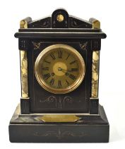 Military interest: A slate and marble mantle clock with Roman numeral dial, the front having a brass