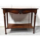 A 19th century flame mahogany side table with serpentine top and a shaped apron decorated with