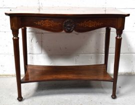 A 19th century flame mahogany side table with serpentine top and a shaped apron decorated with