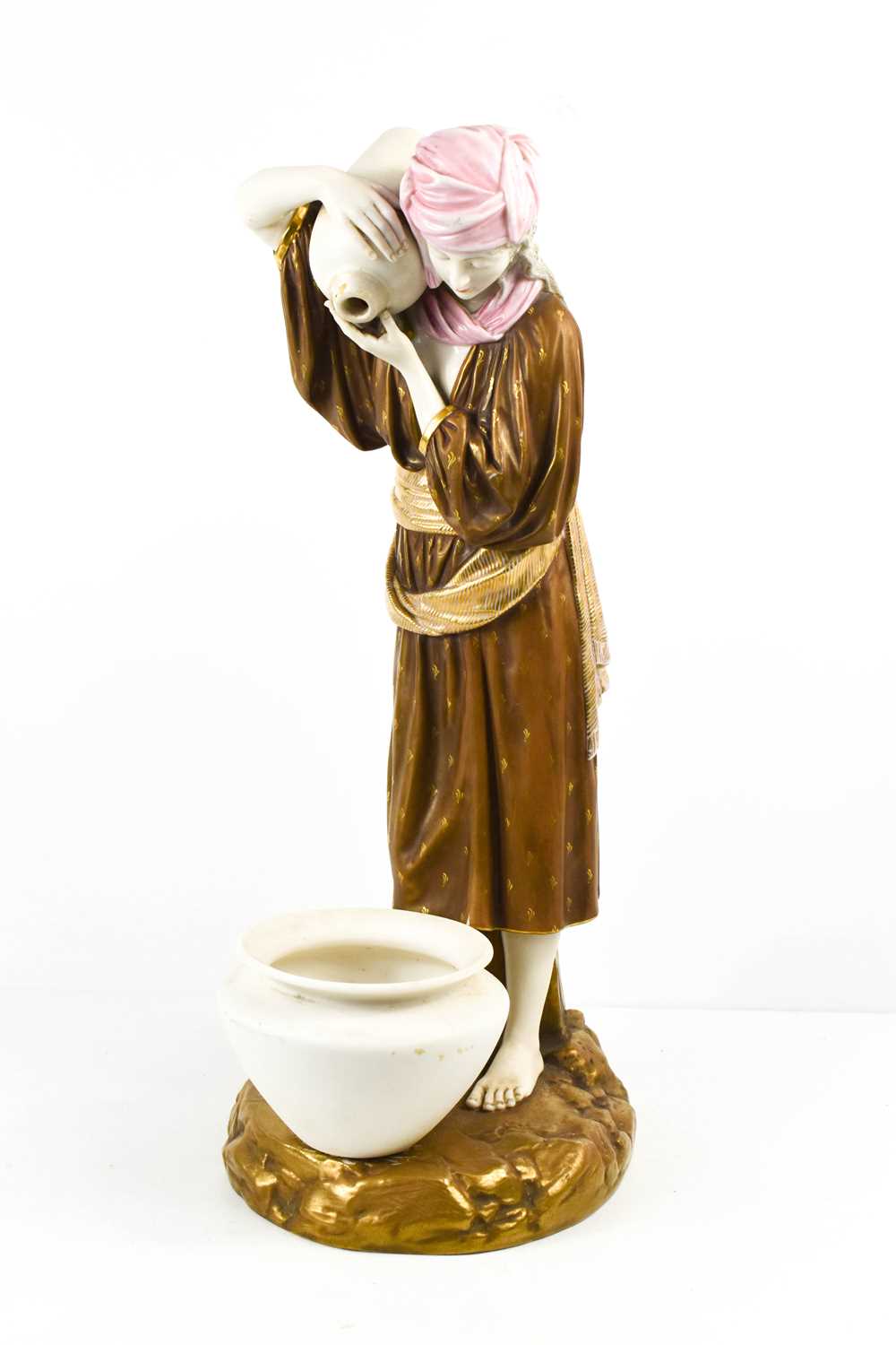 A Royal Worcester porcelain figurine, Water Carrier, puce mark to the base and impressed mark