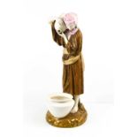A Royal Worcester porcelain figurine, Water Carrier, puce mark to the base and impressed mark