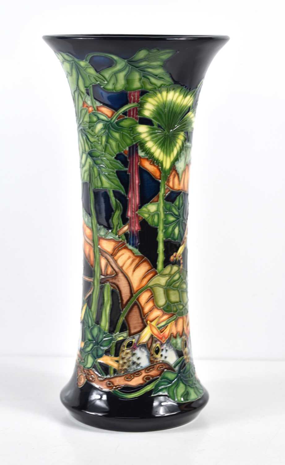 A Moorcroft vase decorated with a bird feeding her chicks, designed and painted by Paul Hildtich,